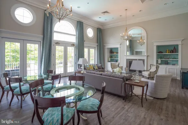 a view of a swimming pool with an outdoor space and seating area