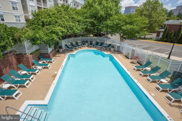 a view of a swimming pool with a patio