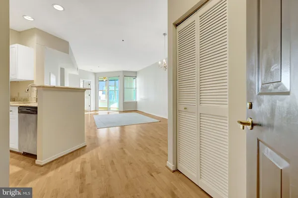 a bathroom with a sink and mirror with toilet