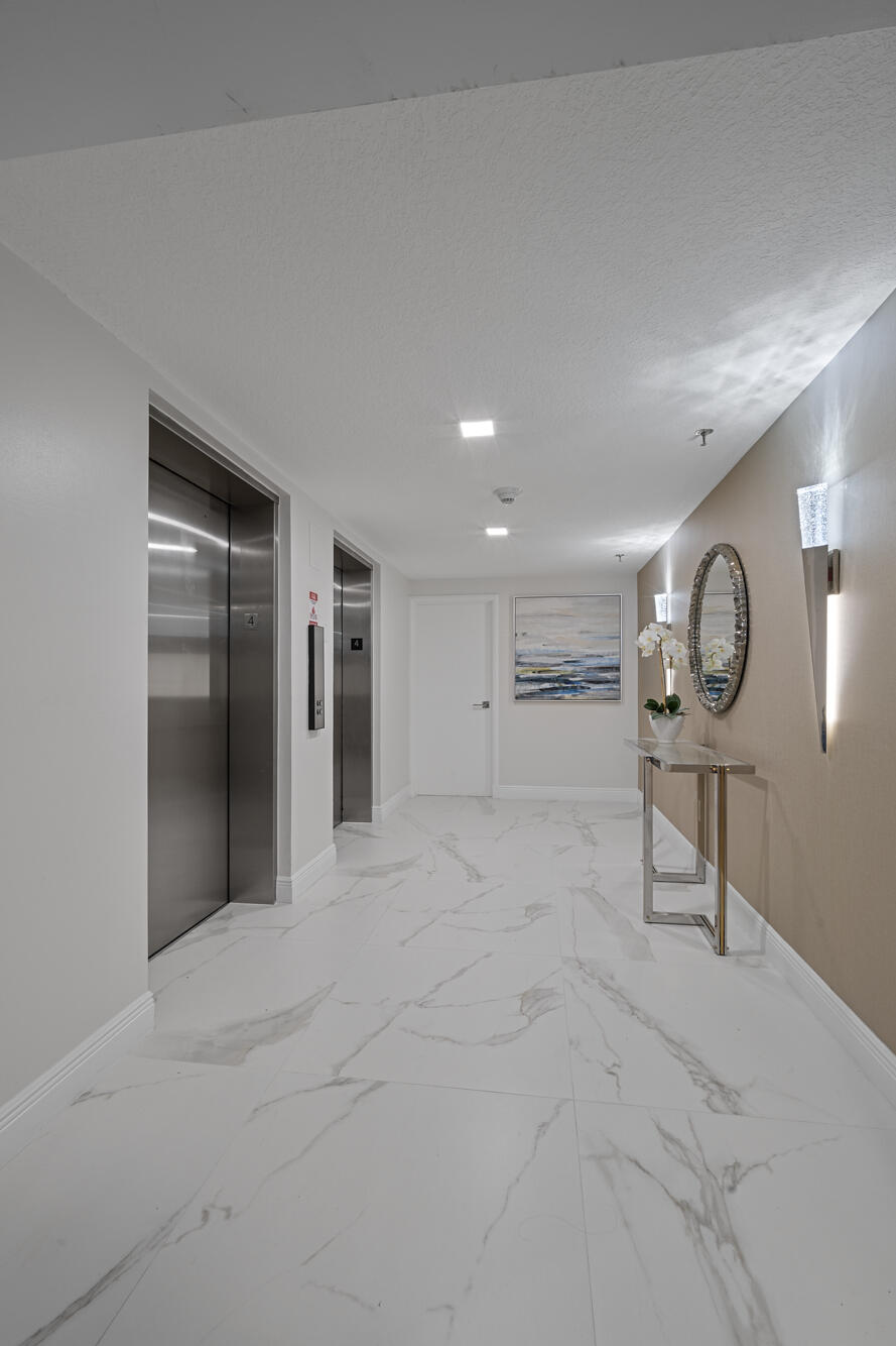 20080 Boca W Drive, Unit 447 Boca Raton, FL 33434 - Photo 27 of 110 Bldg 400 -Newly Tiled Elevator Foyer