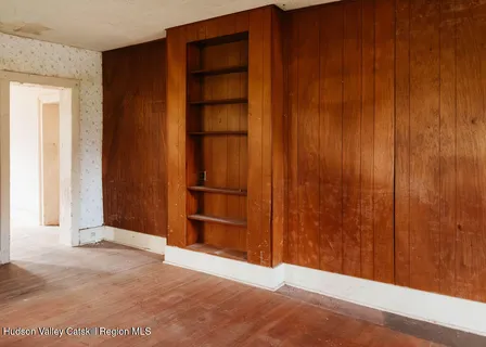 an empty room with wooden door