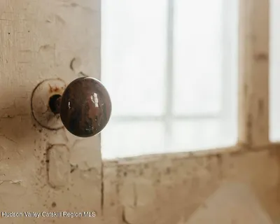 a view of a door and a window