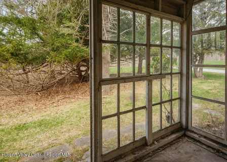 a view of a room with large windows