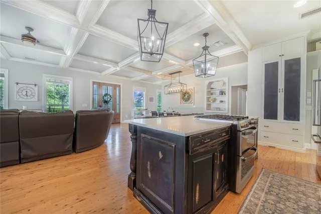 a bathroom with a granite countertop bathtub a sink and a large mirror