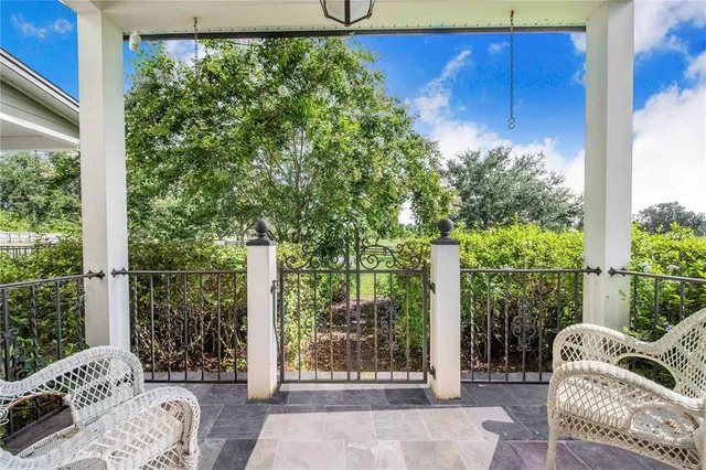 a view of a kitchen with a sink and a refrigerator