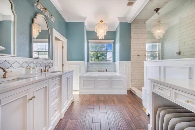 a bathroom with a sink mirror and toilet