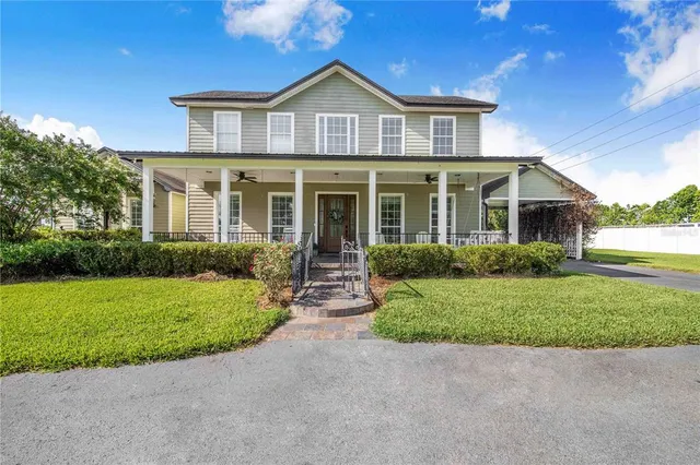 a view of livingroom with furniture window and front door