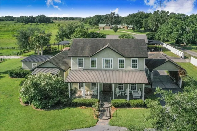 a spacious bedroom with a bed and a flat screen tv