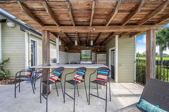 a bathroom with a granite countertop sink a mirror and a bathtub