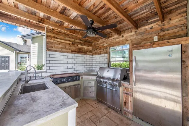a view of a house with backyard porch and sitting area