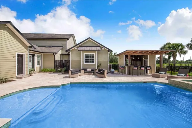 an aerial view of a house with a garden