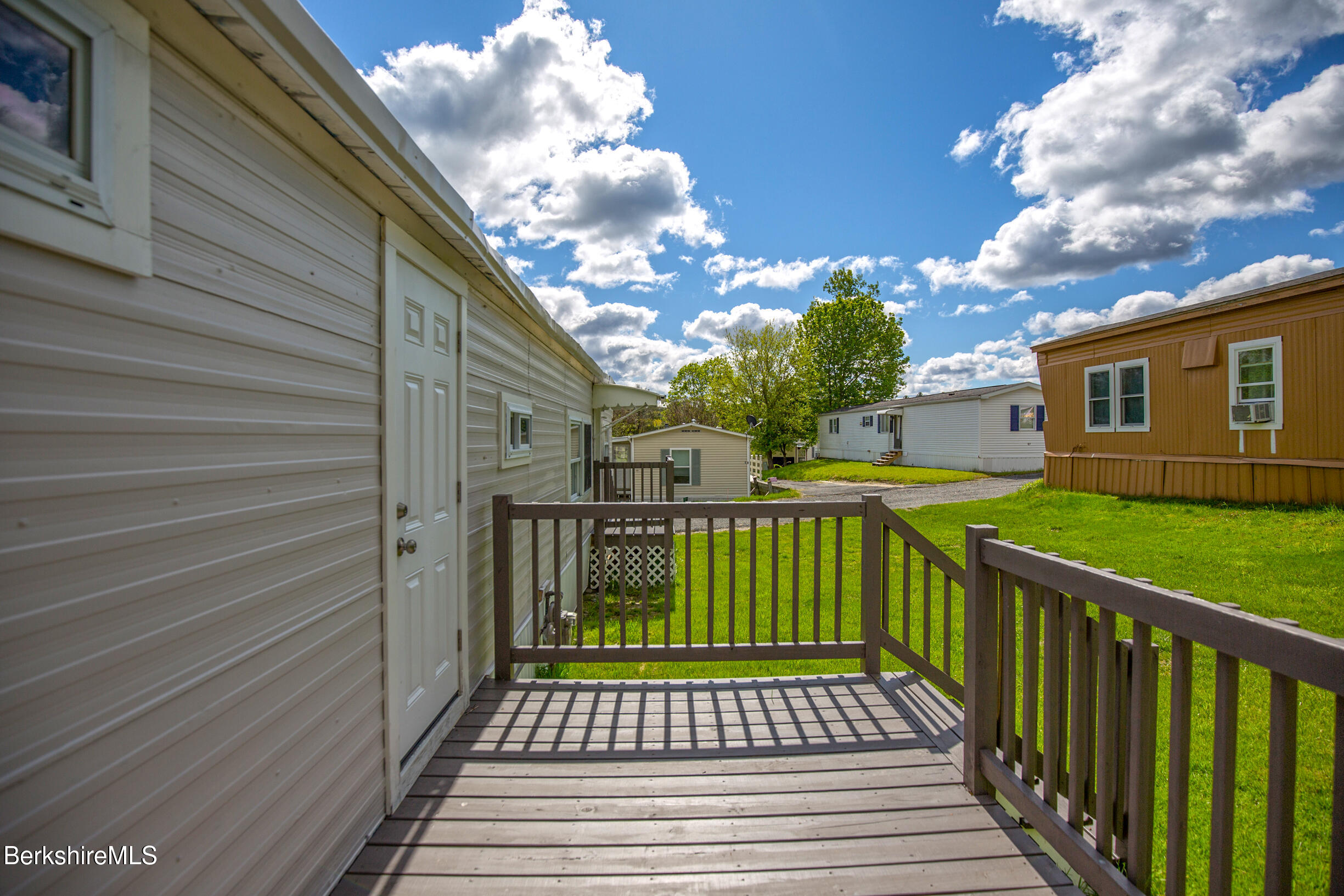 405 Pittsfield Road, Unit LOT F2 Lenox, MA 01240 - Photo 17 of 23 a view of a wooden deck with a yard