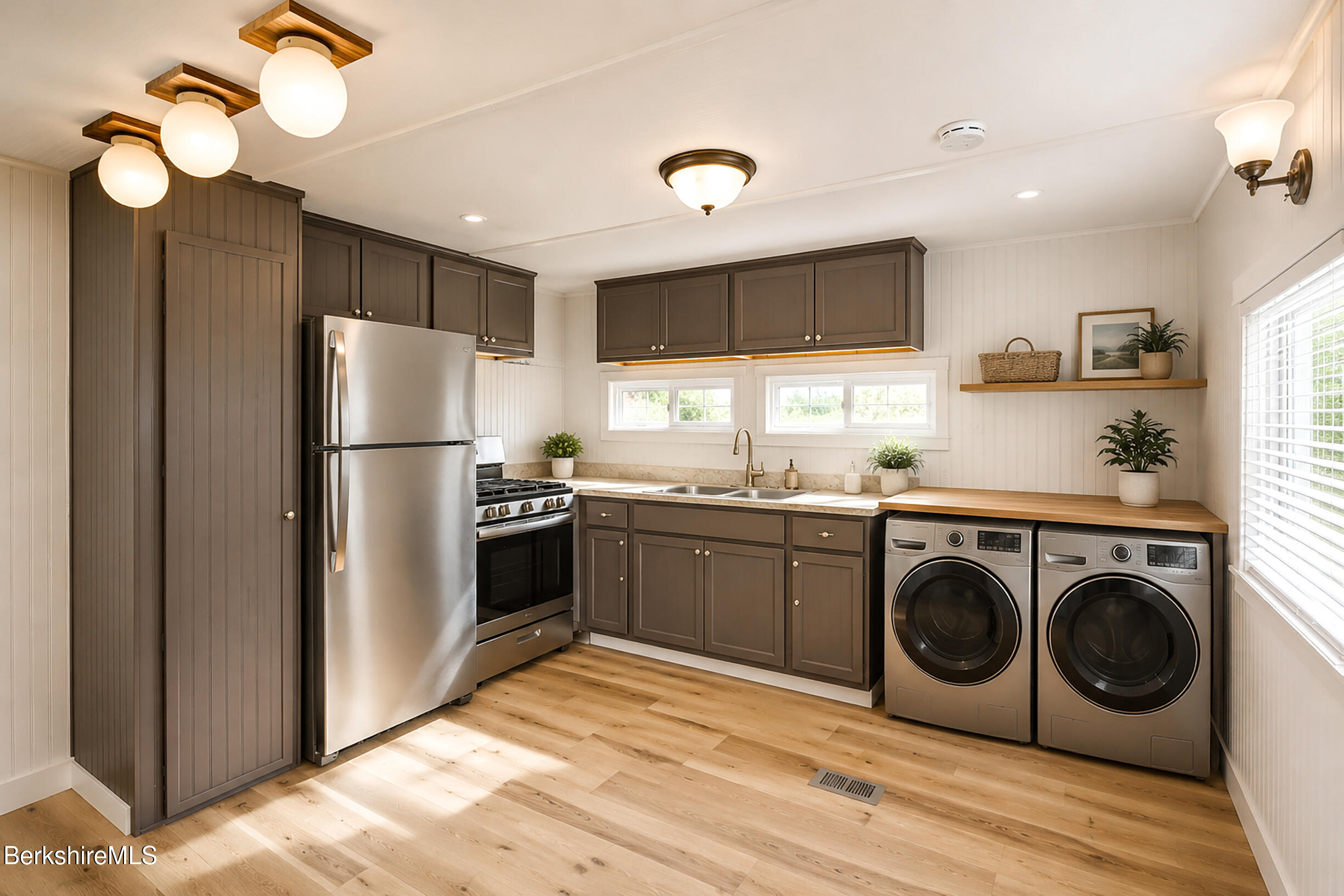 405 Pittsfield Road, Unit LOT F2 Lenox, MA 01240 - Photo 18 of 23 a kitchen with a refrigerator sink and cabinets