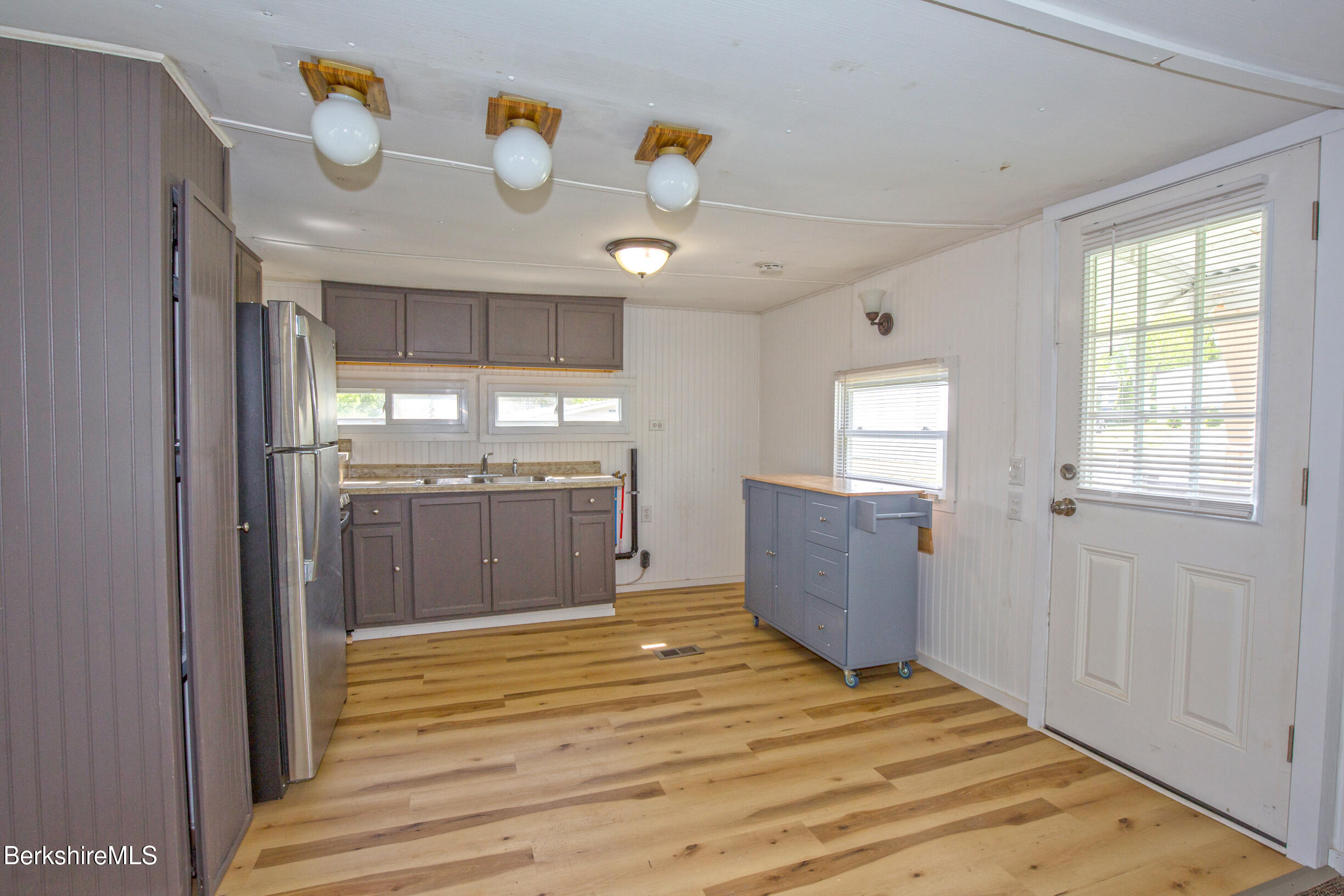 405 Pittsfield Road, Unit LOT F2 Lenox, MA 01240 - Photo 4 of 23 a kitchen with a sink cabinets and window