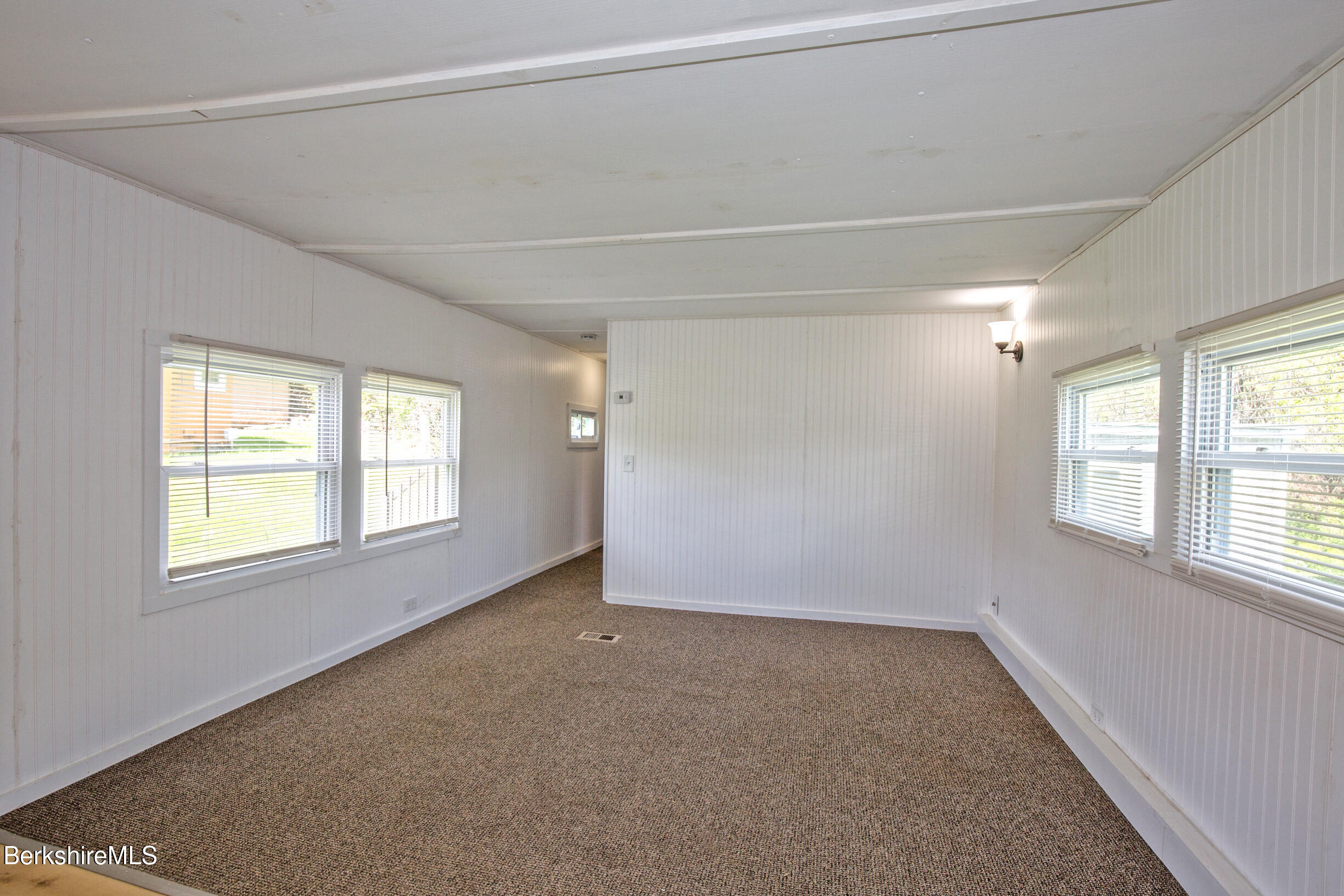 405 Pittsfield Road, Unit LOT F2 Lenox, MA 01240 - Photo 5 of 23 a view of an empty room with a window