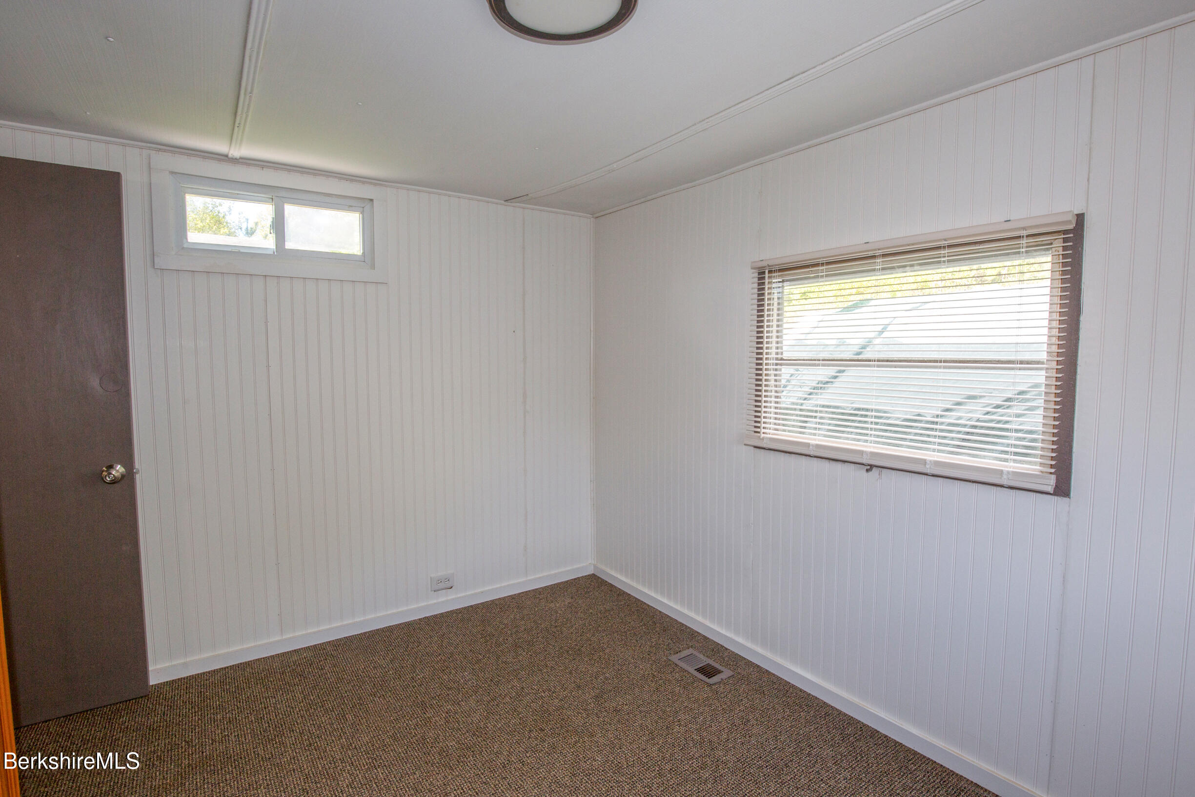 405 Pittsfield Road, Unit LOT F2 Lenox, MA 01240 - Photo 6 of 23 an empty room with a window