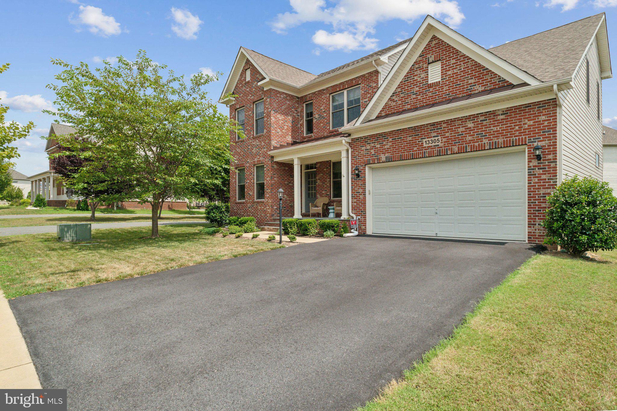 13305 Windy Meadow Lane Silver Spring, MD 20906 - Photo 2 of 25 Charming brick home with lush greenery.