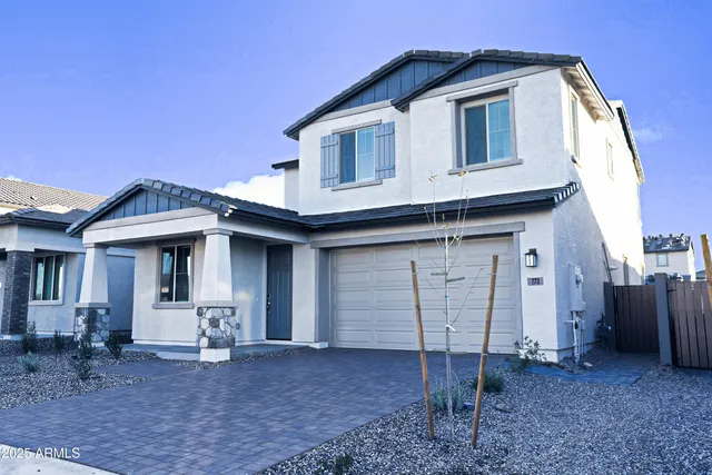 a front view of a house with backyard