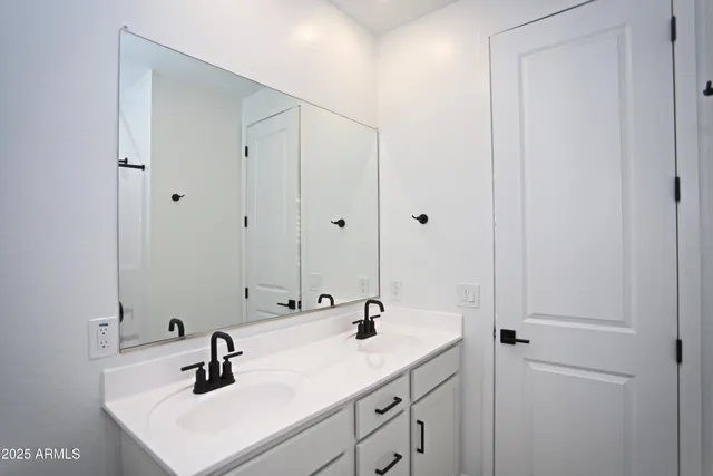 a view of a river and garden with seating area