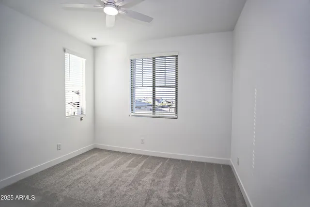 a view of chairs and tables in the patio