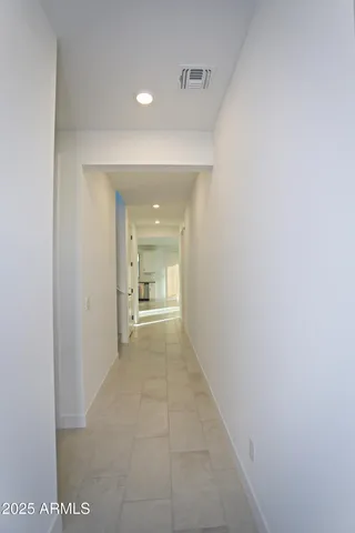 a view of a hallway to a room