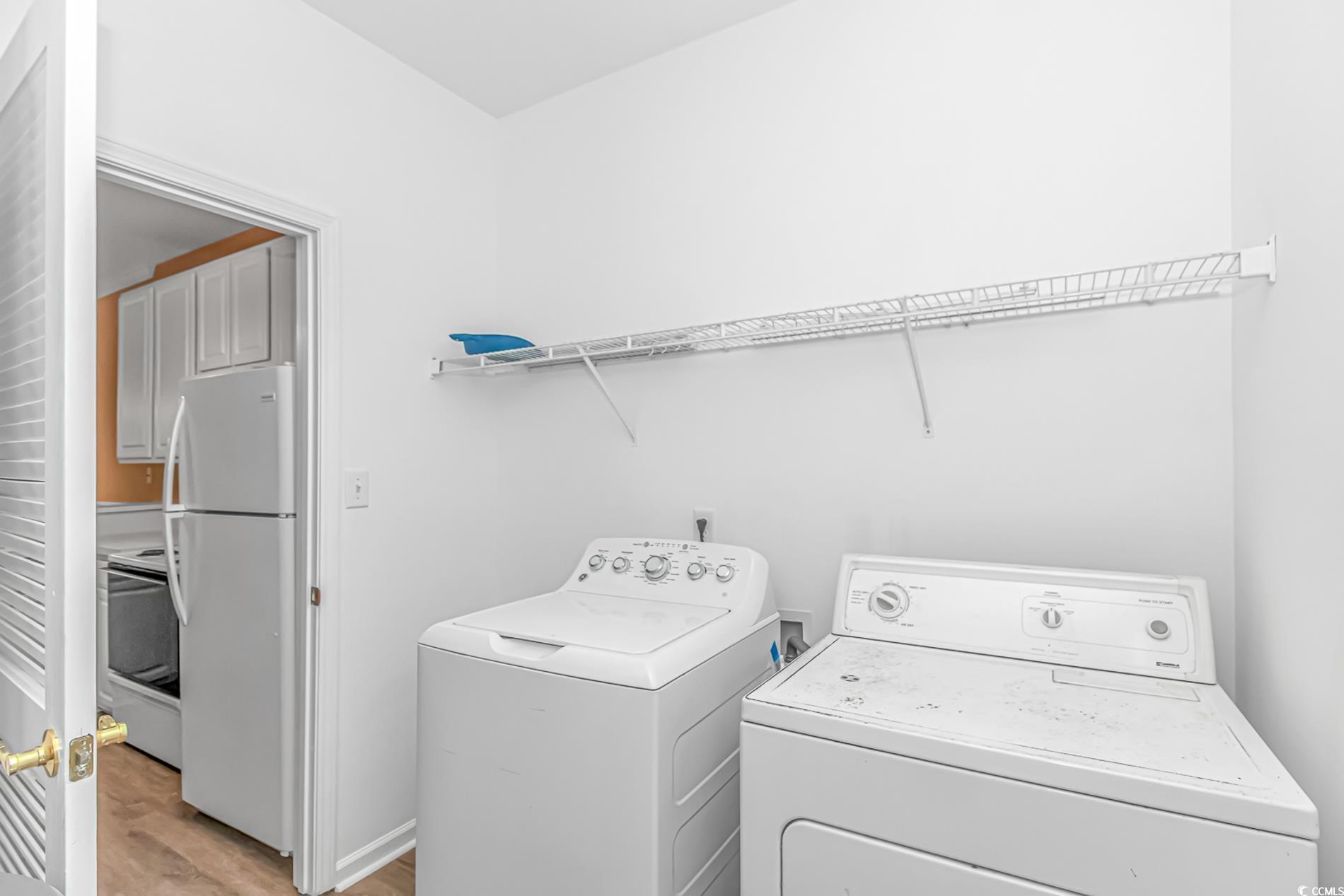 4814 Innisbrook Court, Unit 407 Myrtle Beach, SC 29579 - Photo 11 of 31 Laundry area with independent washer and dryer and light wood finished floors
