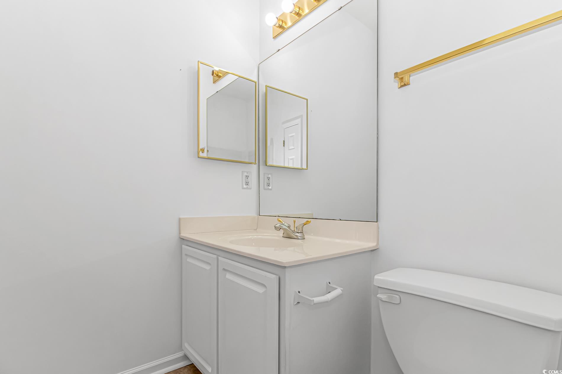 4814 Innisbrook Court, Unit 407 Myrtle Beach, SC 29579 - Photo 19 of 31 Half bathroom with vanity and toilet