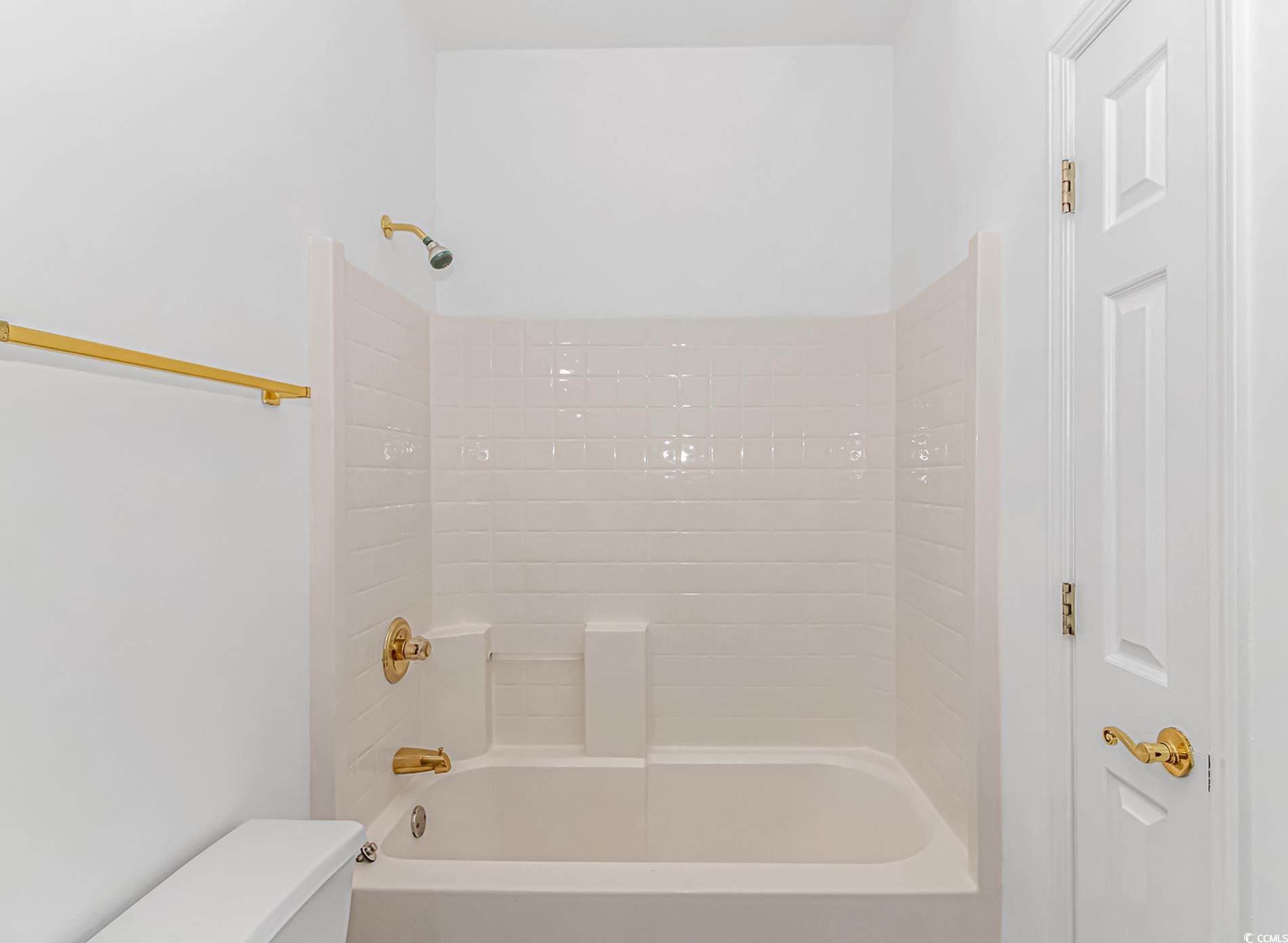 4814 Innisbrook Court, Unit 407 Myrtle Beach, SC 29579 - Photo 20 of 31 Full bathroom featuring tub / shower combination and toilet