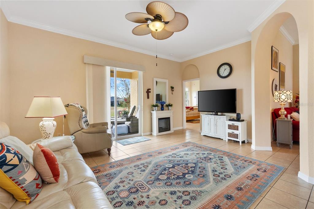 17031 Southeast 115th Terrace Road Summerfield, FL 34491 - Photo 17 of 54 a living room with furniture and a flat screen tv