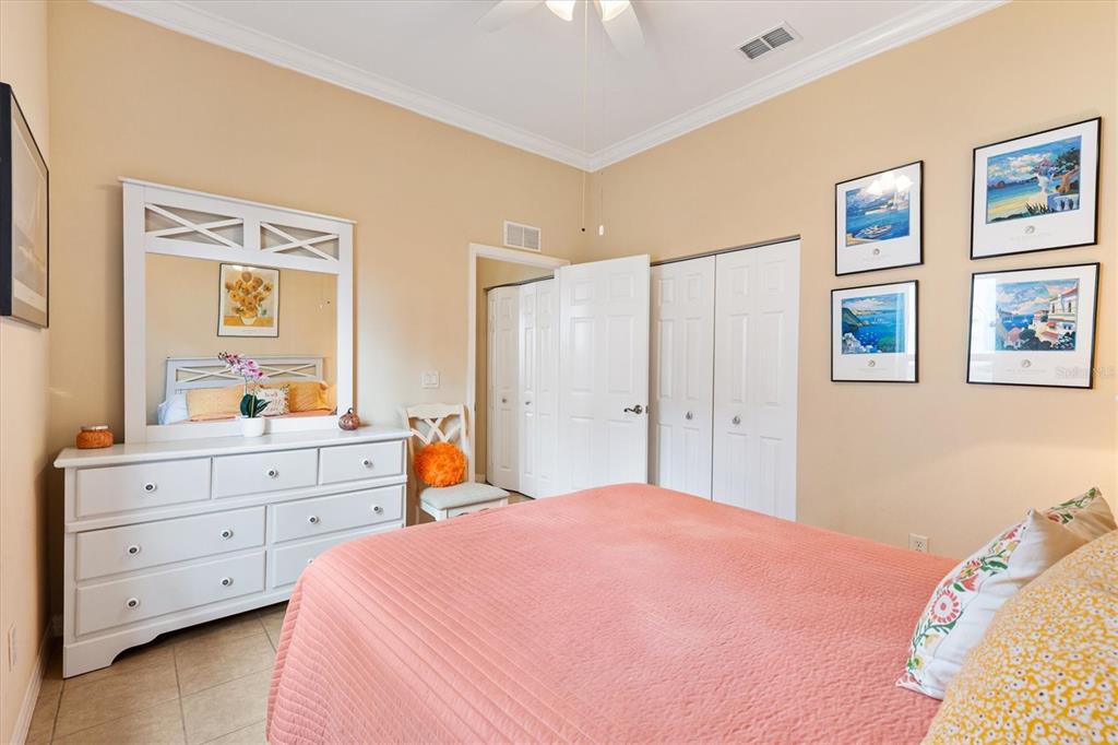 17031 Southeast 115th Terrace Road Summerfield, FL 34491 - Photo 23 of 54 a bedroom with a bed and a dresser