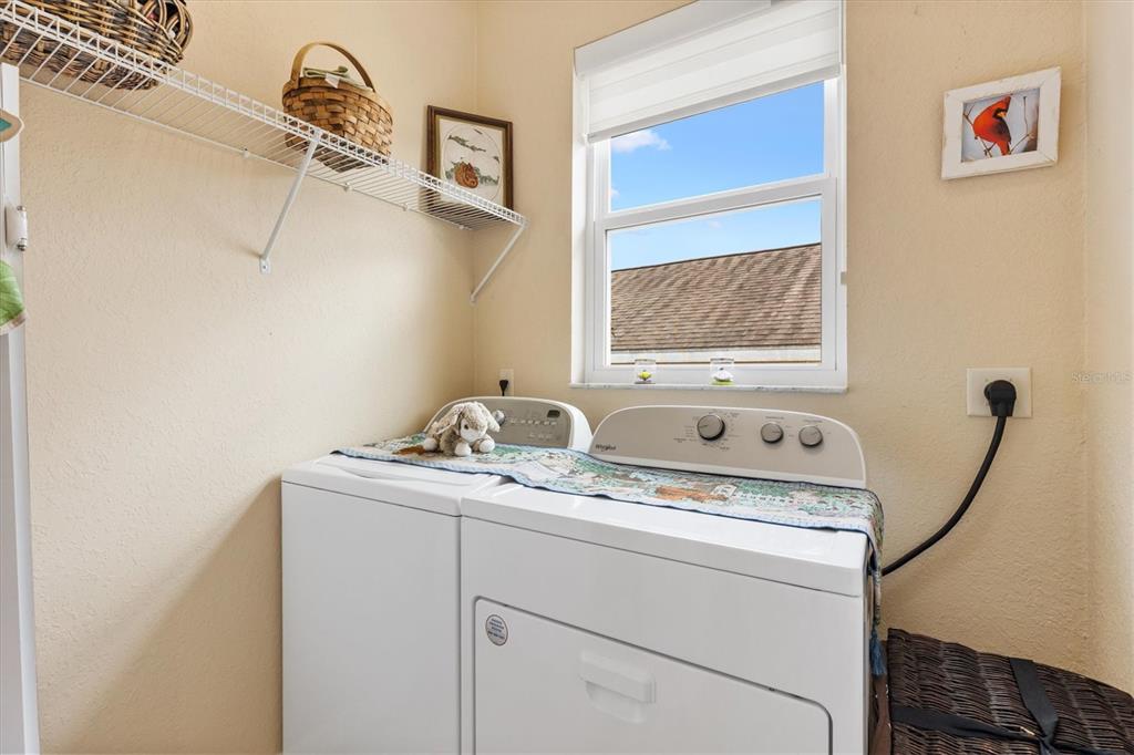 17031 Southeast 115th Terrace Road Summerfield, FL 34491 - Photo 27 of 54 a utility room with dryer and washer