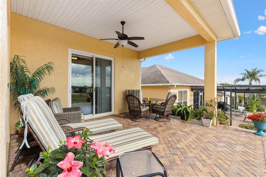 17031 Southeast 115th Terrace Road Summerfield, FL 34491 - Photo 30 of 54 a dining room with furniture and a floor to ceiling window
