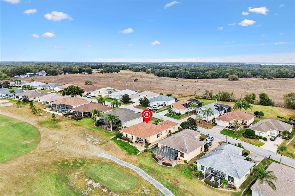 17031 Southeast 115th Terrace Road Summerfield, FL 34491 - Photo 40 of 54 an aerial view of residential houses with outdoor space
