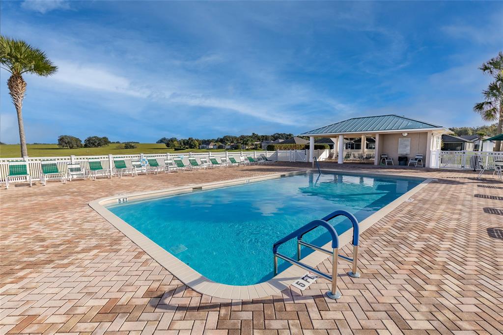 17031 Southeast 115th Terrace Road Summerfield, FL 34491 - Photo 50 of 54 a view of a swimming pool with an ocean view