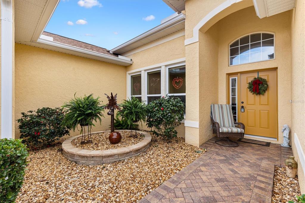 17031 Southeast 115th Terrace Road Summerfield, FL 34491 - Photo 5 of 54 a view of a small pool with a yard