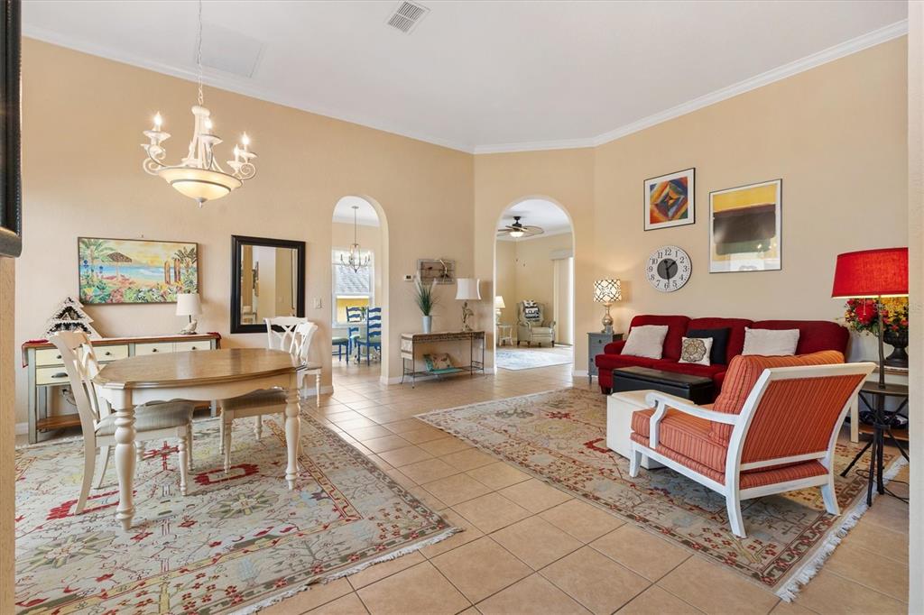 17031 Southeast 115th Terrace Road Summerfield, FL 34491 - Photo 7 of 54 a living room with furniture and wooden floor