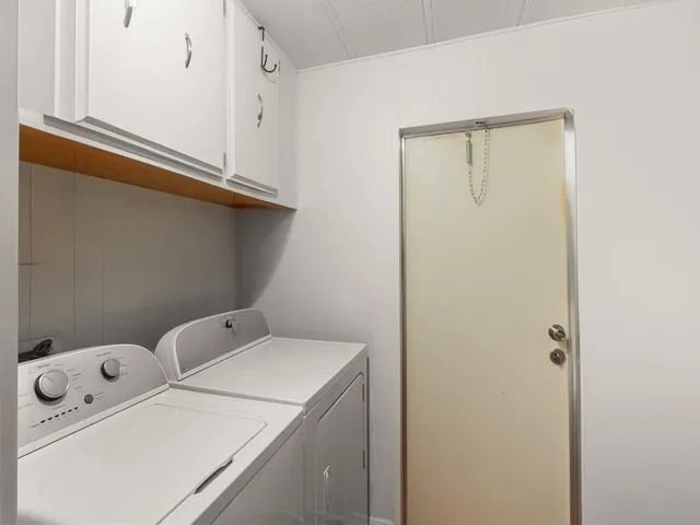 a utility room with dryer and washer
