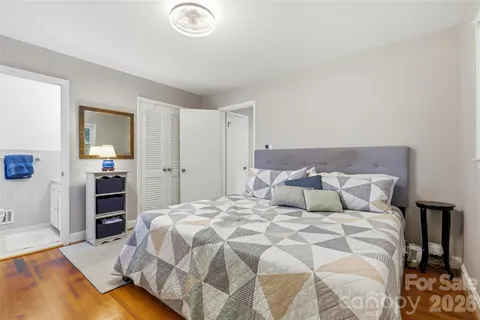 a large bed in a white room