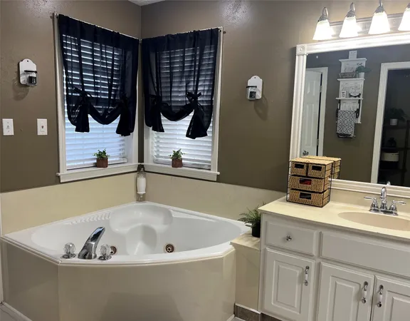 a bathroom with a bathtub and a sink