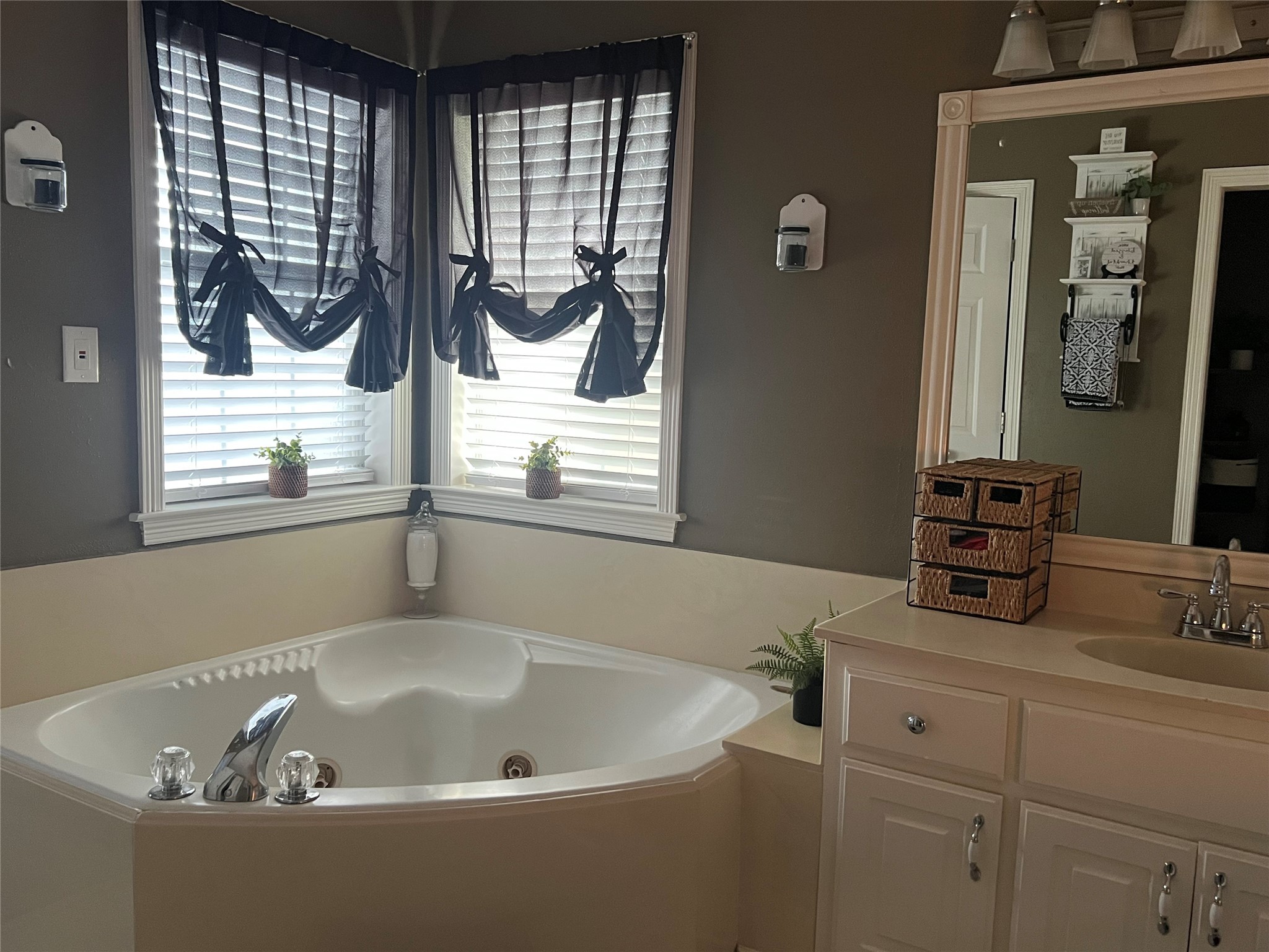 2305 Katherine Street Brenham, TX 77833 - Photo 24 of 37 a bath tub sitting in a bathroom next to a window