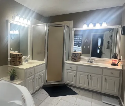 a bathroom with a double vanity sink mirror and double