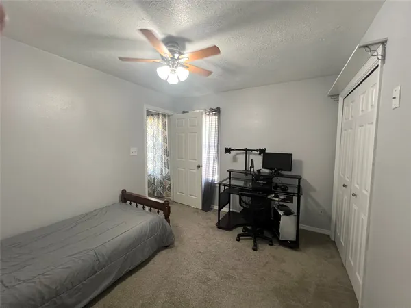 a view of a workspace with furniture