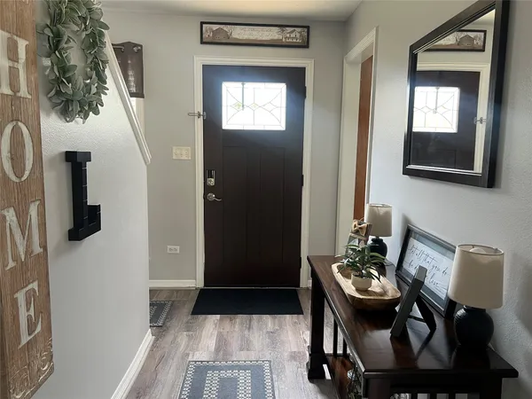 a view of kitchen with furniture and windows