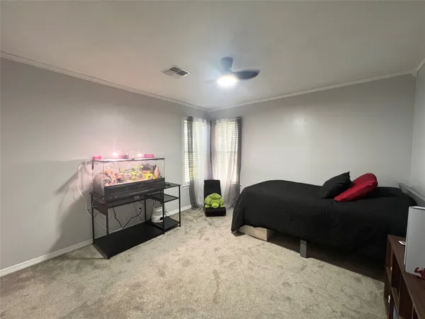a bedroom with furniture and a bed