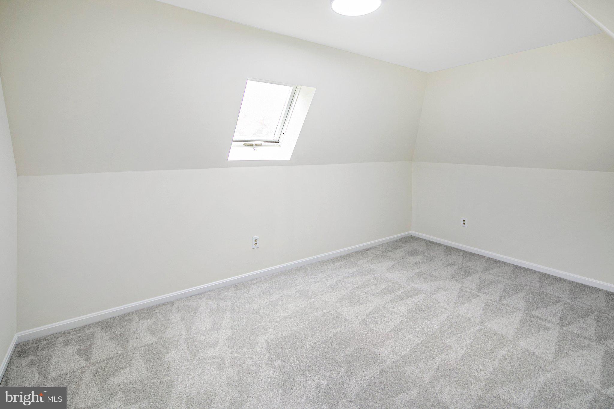 426 Pershing Drive Silver Spring, MD 20910 - Photo 18 of 36 Upper level bedroom two w/ skylight