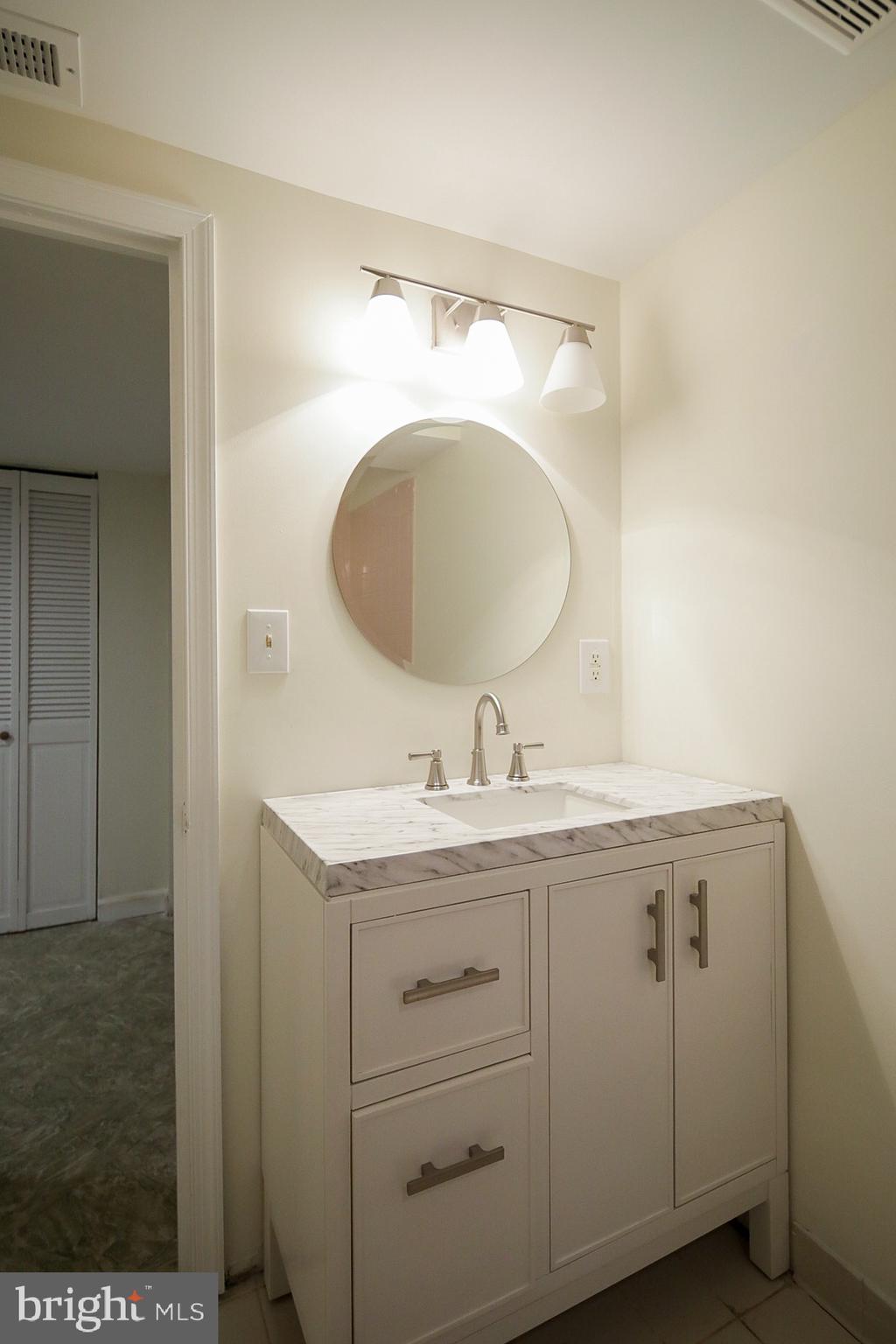 426 Pershing Drive Silver Spring, MD 20910 - Photo 30 of 36 Lower level bath w/ new vanity