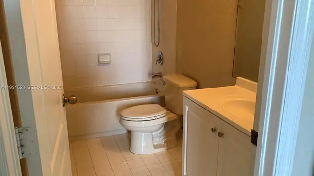 a bathroom with a toilet and a sink