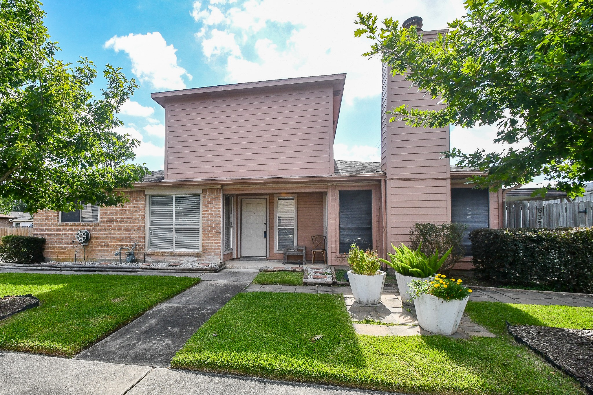 8323 East Ridge Drive Houston, TX 77040 - Photo 2 of 31 a view of a house with a yard and plants