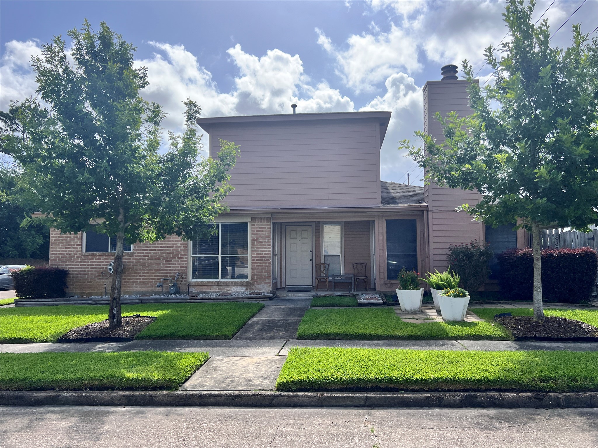 8323 East Ridge Drive Houston, TX 77040 - Photo 28 of 31 a front view of a house with a yard and garage