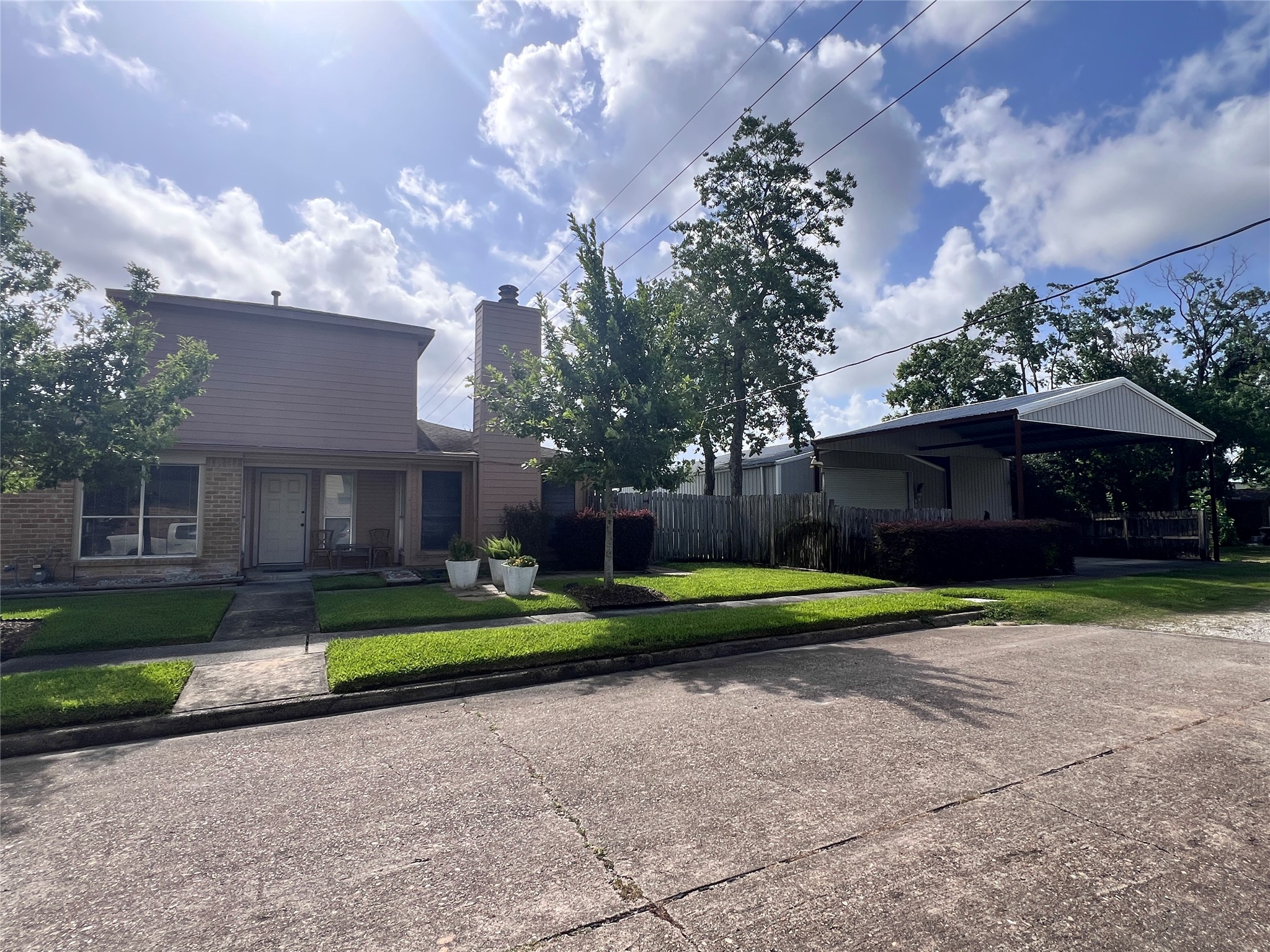 8323 East Ridge Drive Houston, TX 77040 - Photo 29 of 31 a front view of a house with a yard and trees